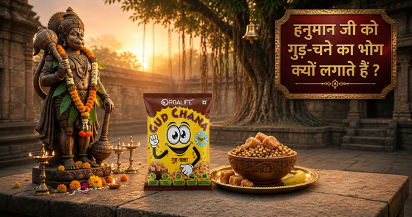 A devotional scene featuring Lord Hanuman, an Orgalife Gud Chana packet, and a bowl of jaggery with roasted gram prasad, symbolizing the traditional Tuesday offering for blessings, strength, and positive energy.